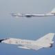 An F-106A Delta Dart of the 102nd Fighter Interceptor Wing of the Massachusetts Air National Guard intercepts a Soviet electronic intelligenceTu-95RT (Bear-D) off the coast of Yarmouth, Nova Scotia in 1982 (US Air Force)